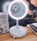White acrylic frame LED vanity mirror with USB charging and foldable design