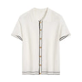 White short-sleeved cardigan with dark contrast lapels laid flat.
