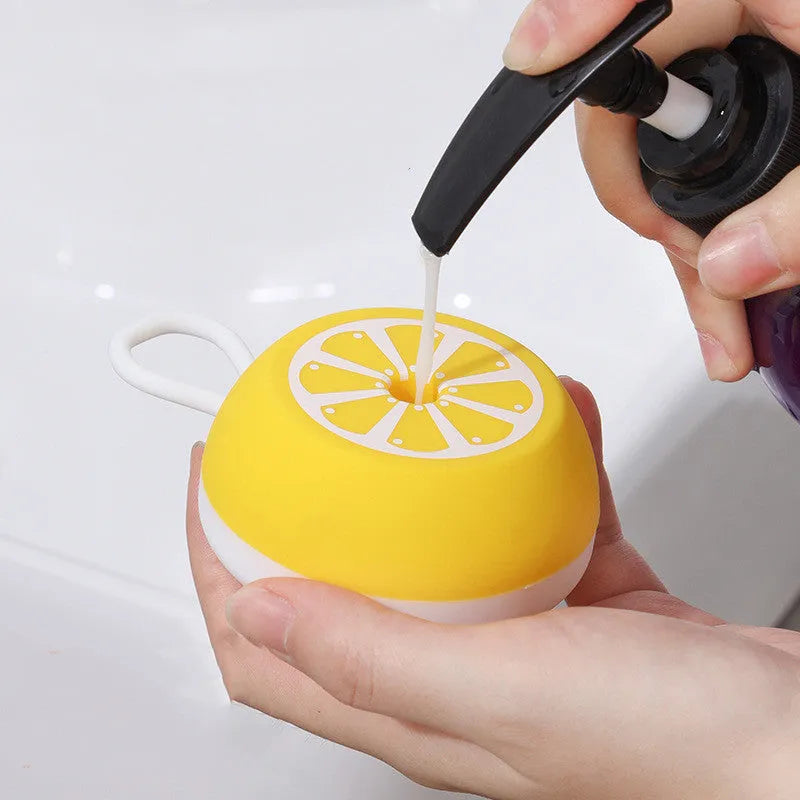 Yellow silicone pet bath brush with massage head design for dog and cat grooming during bath time