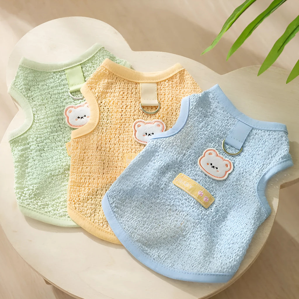 Green knitted cat clothes with bear patch showing hollowed-out breathable design