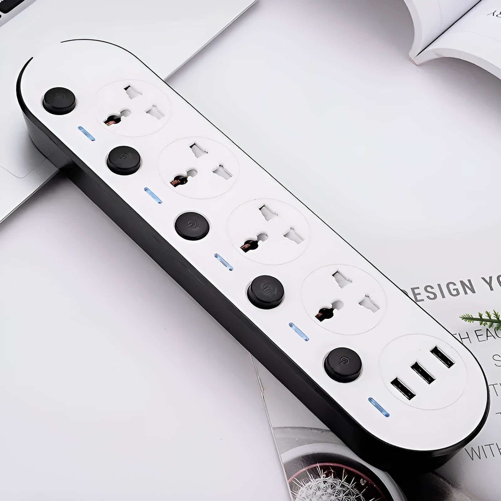 Multi-switch power strip with international sockets, USB ports, and a long cable on a desk.
