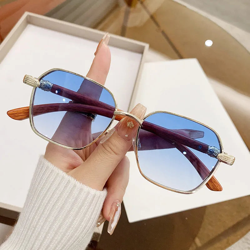 Frameless trim women's alloy frame glasses with wood grain effect in gold and blue colour option.