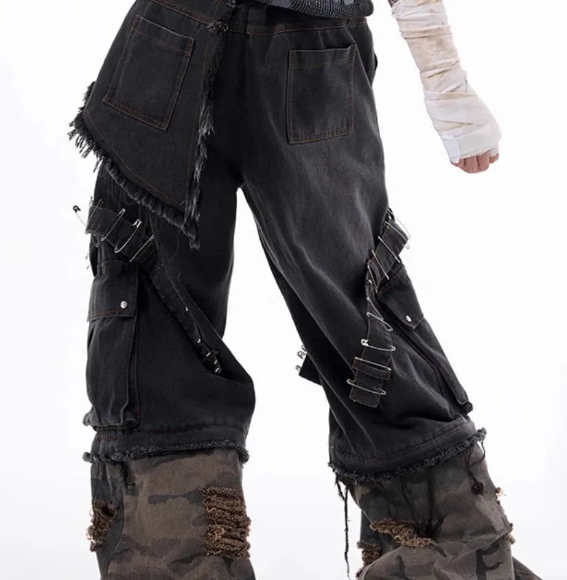 Grey men's camouflage print jeans with structural splicing and ribbon detailing on cotton denim.