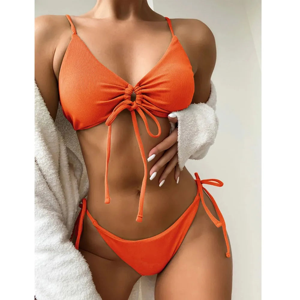 Women's solid colour drawstring bikini swimsuit in quick-dry fabric on a mannequin.