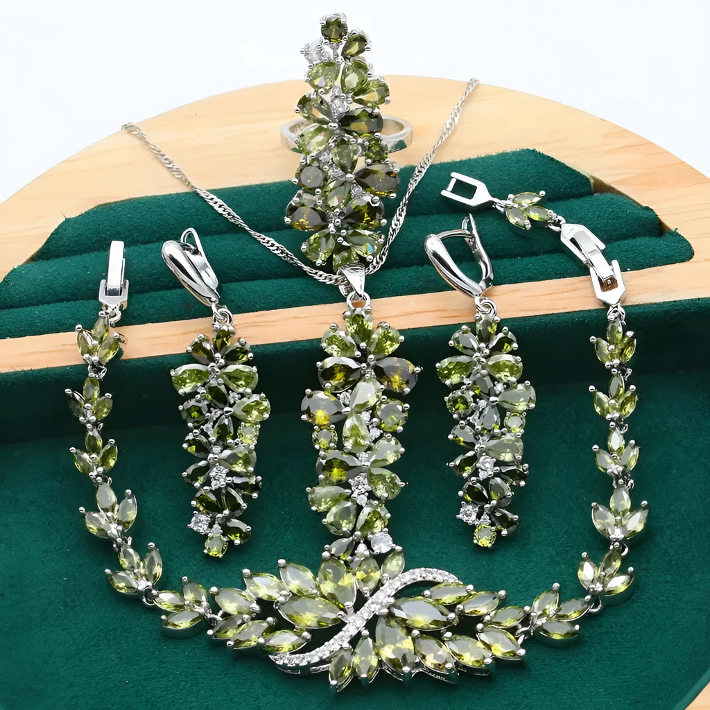 Retro botanical pattern jewellery set in copper alloy with zircon stones, showing necklace, bracelet, earrings, and ring.