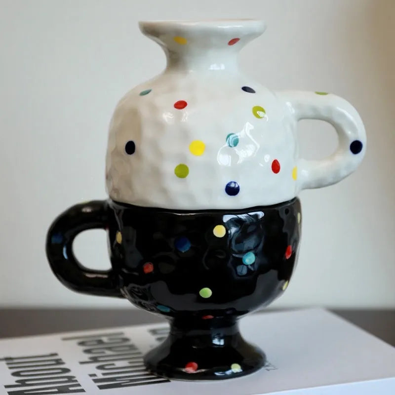 Hand-pinched irregular shaped ceramic mug in a solid colour, shown from the side.
