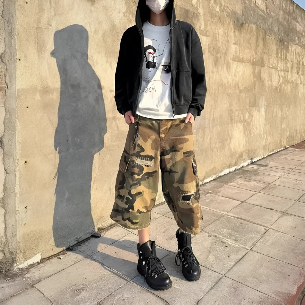 Men's camouflage cropped jeans with retro patches and ripped detailing on loose straight-leg trousers