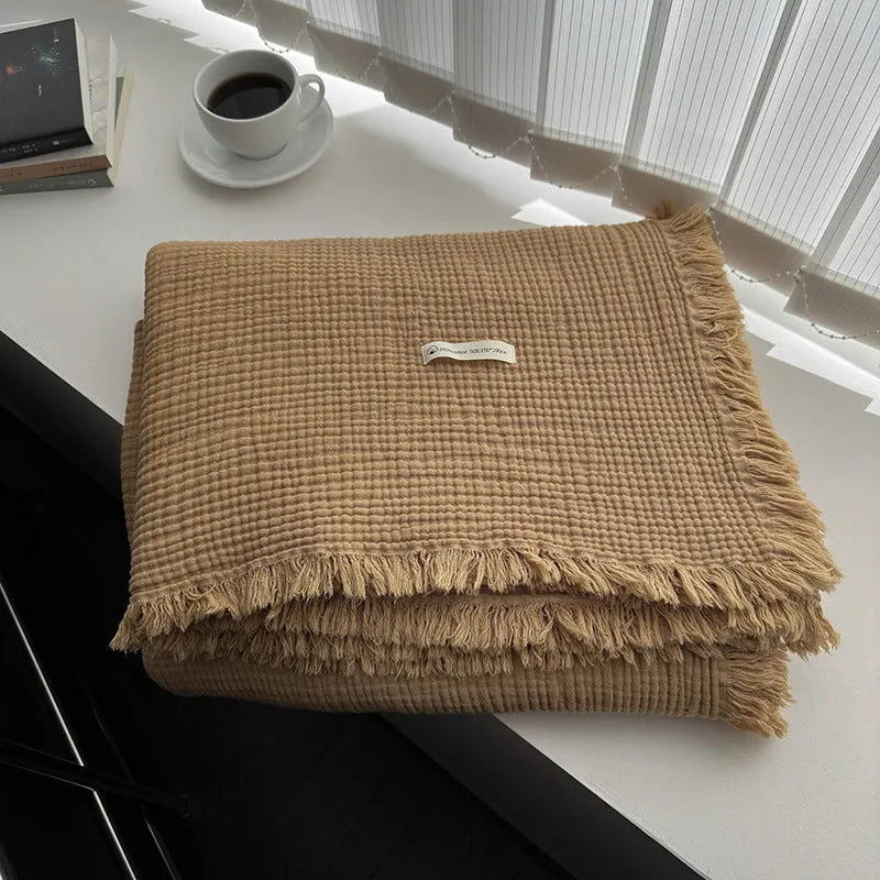 Four-layer gauze cotton blanket with tassel detailing in avocado green colour