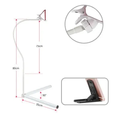 Black bedside mobile phone holder with universal clip and adjustable overhead support shelf mounted on bed frame