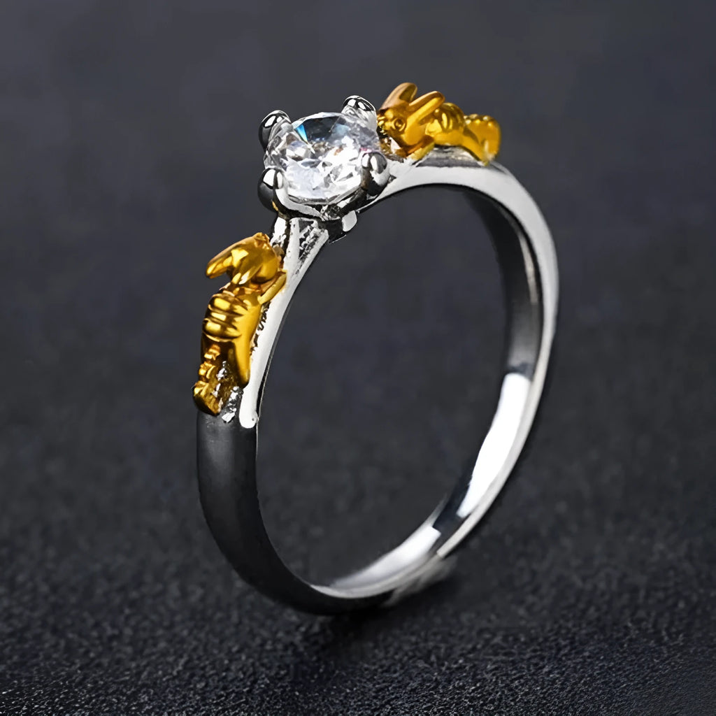 Copper crown modelling cosplay ring in a black gold finish on a hand.
