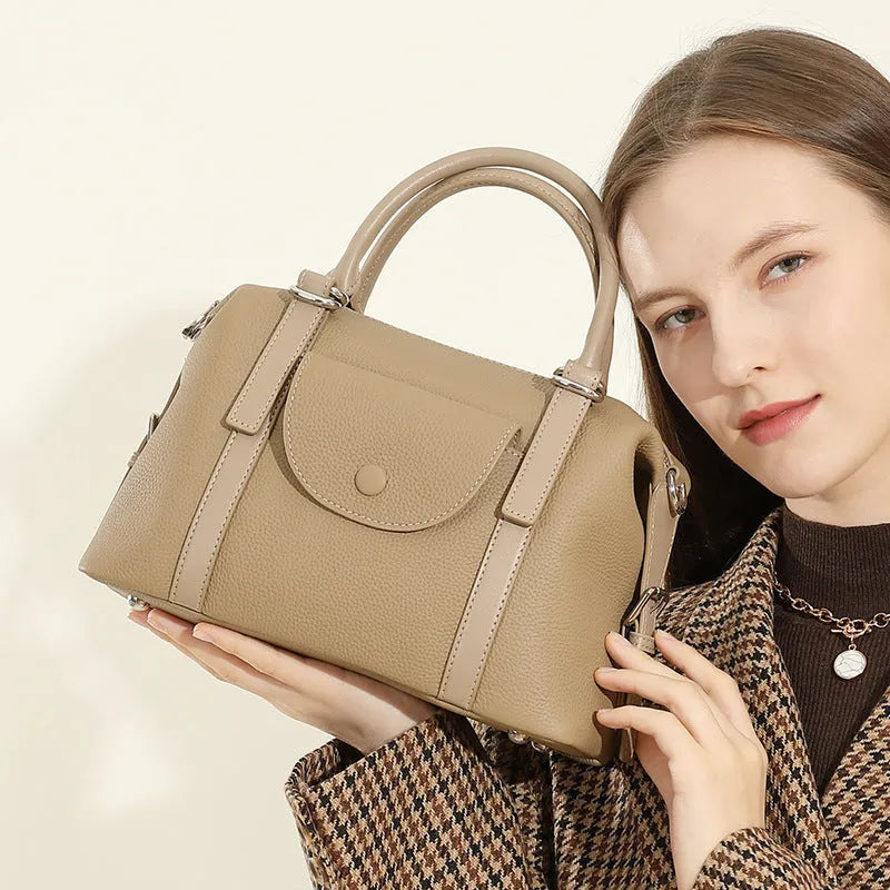 Genuine leather street trend ladies handbag with single shoulder strap in black, brown, or elephant grey.
