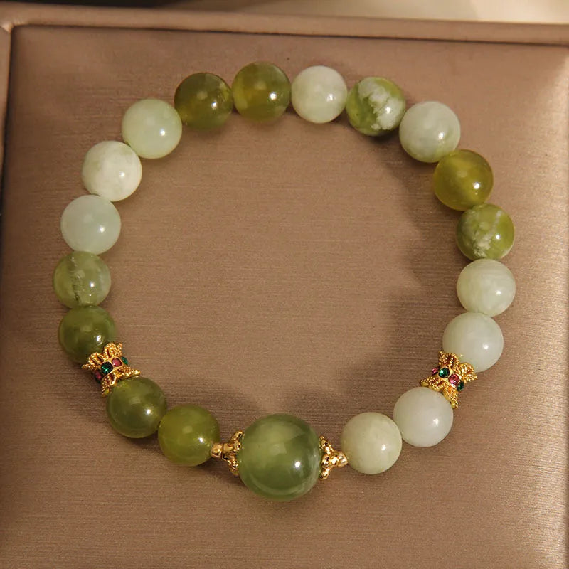 Women's bracelet made of green Xiuyan jade in a light luxury sweet Mori style design.