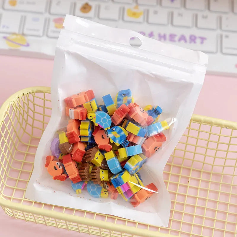 50 small colourful cartoon erasers in a pearlescent bag showing fruit, animal, cake, and Halloween themes.