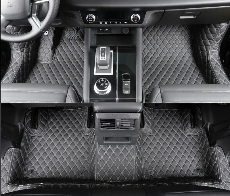 Custom black PU floor mats fitted in a Mitsubishi Outlander footwell.