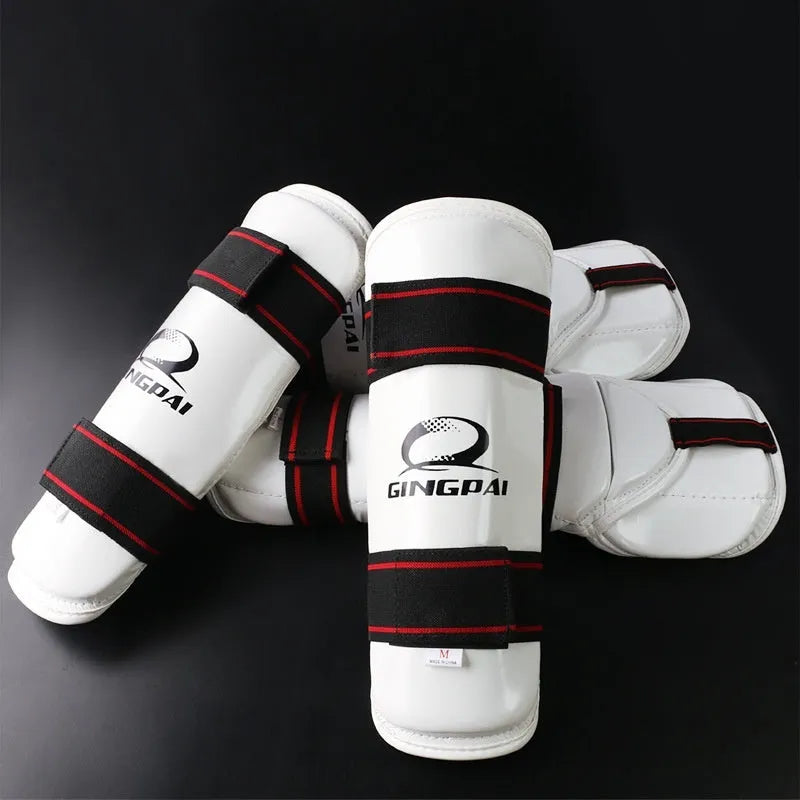 Taekwondo protective set showing black leg guards, arm guards, and elbow guards made from PU and EVA foam materials.