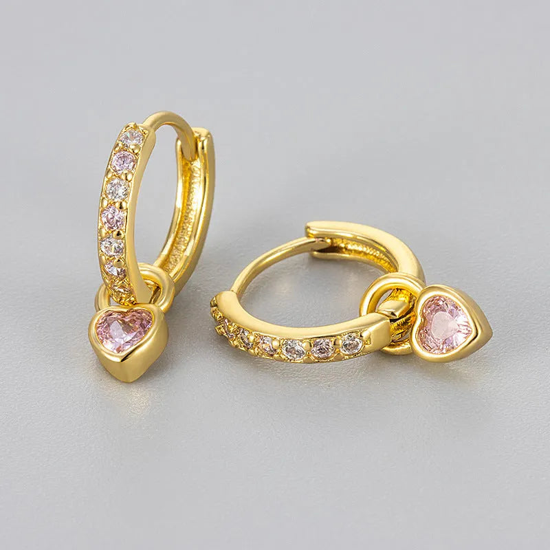 Women's heart-shaped ear clips with a coloured stone, available in gold or white gold colour.