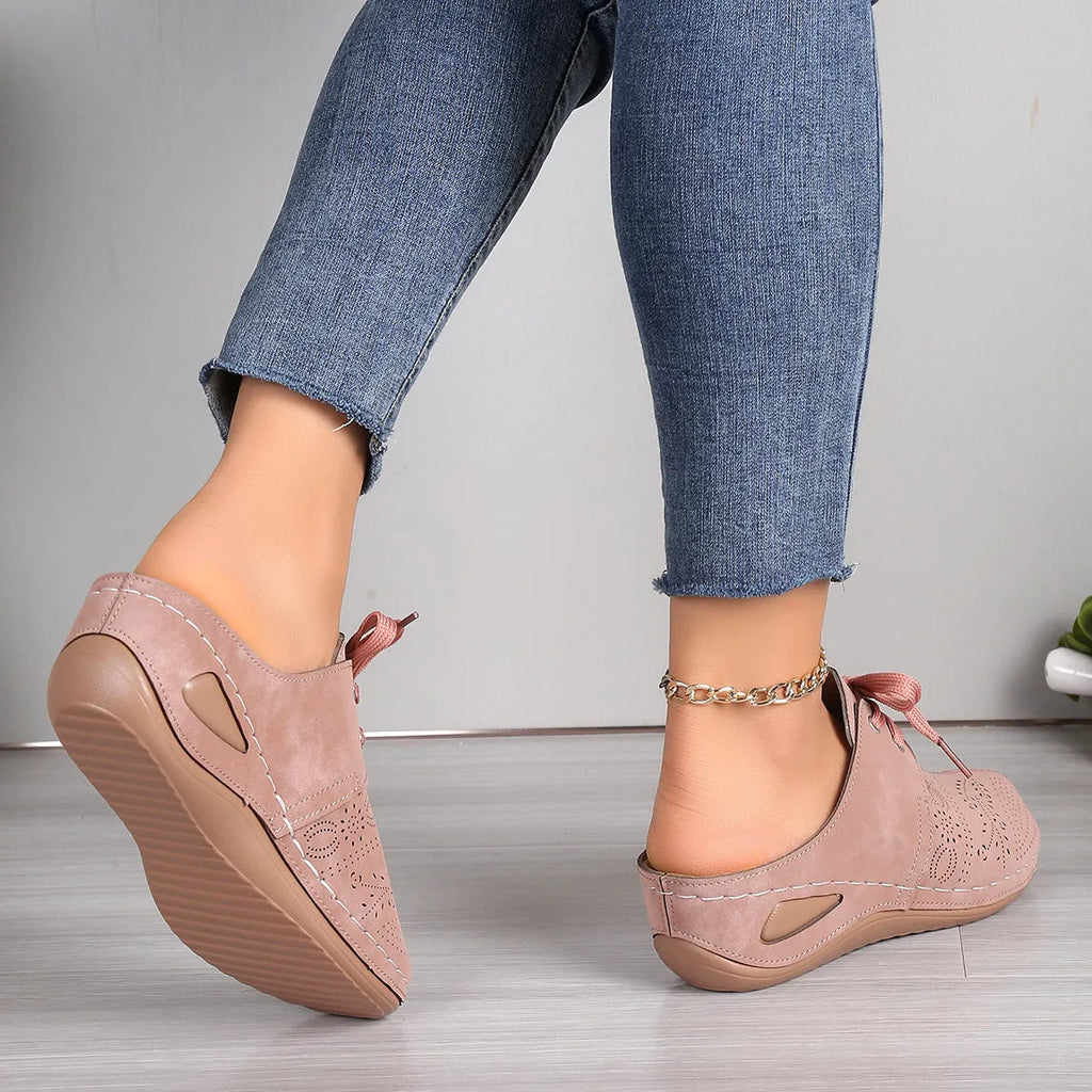 Women's black suede lace-up wedge slippers with a baotou toe and hollow out heel on a rubber sole.