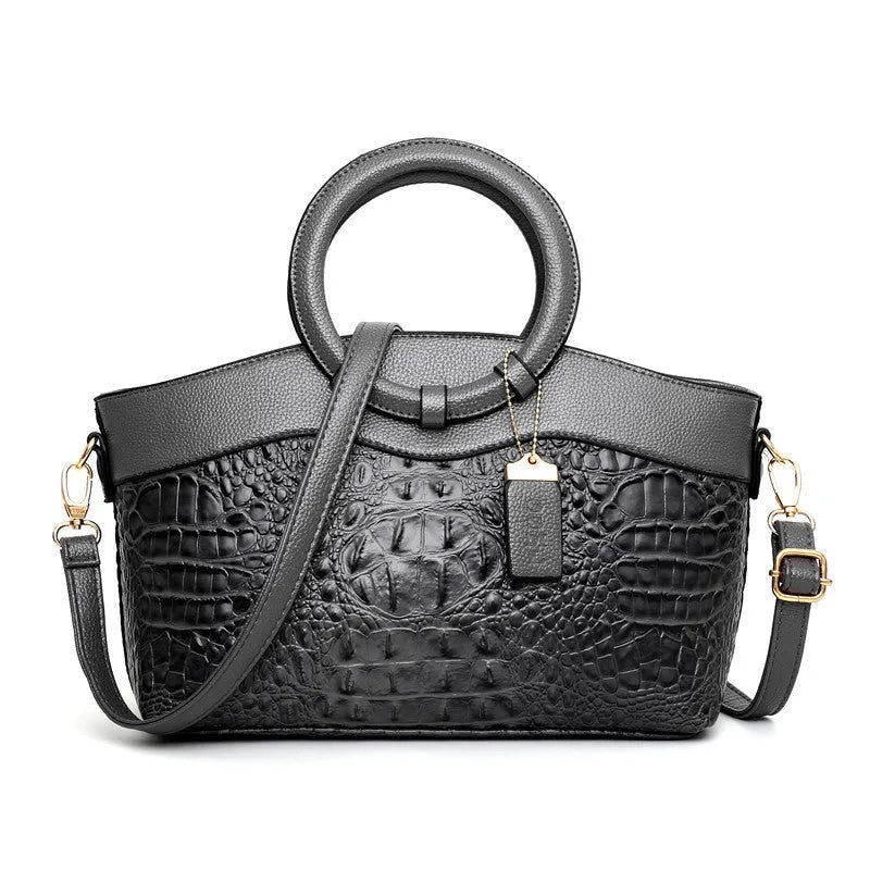 Ladies fabric handbag with multiple zipper compartments in six colour options showing organisational pockets