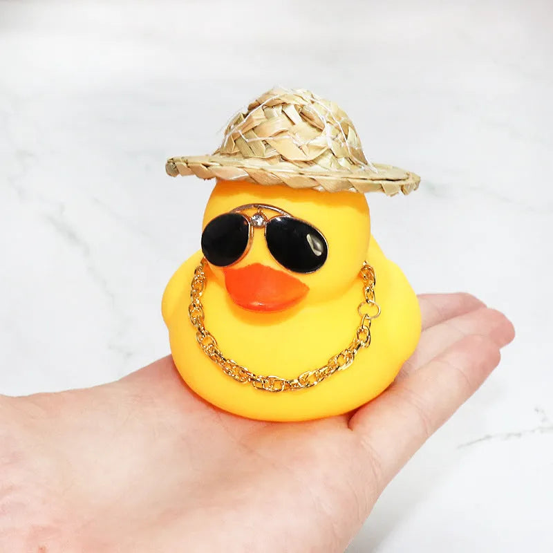 Yellow duck cartoon character wearing straw hat car dashboard ornament with sunglasses and necklace accessories