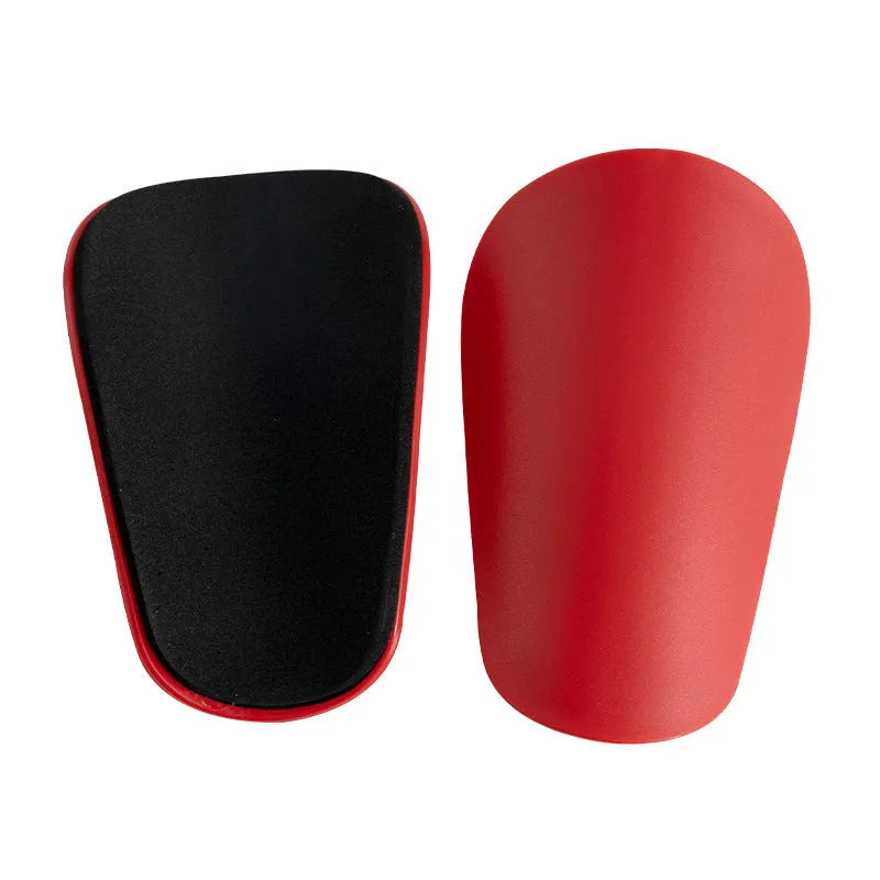 Pair of black PU mini shin guards for sports protection, showing S size.