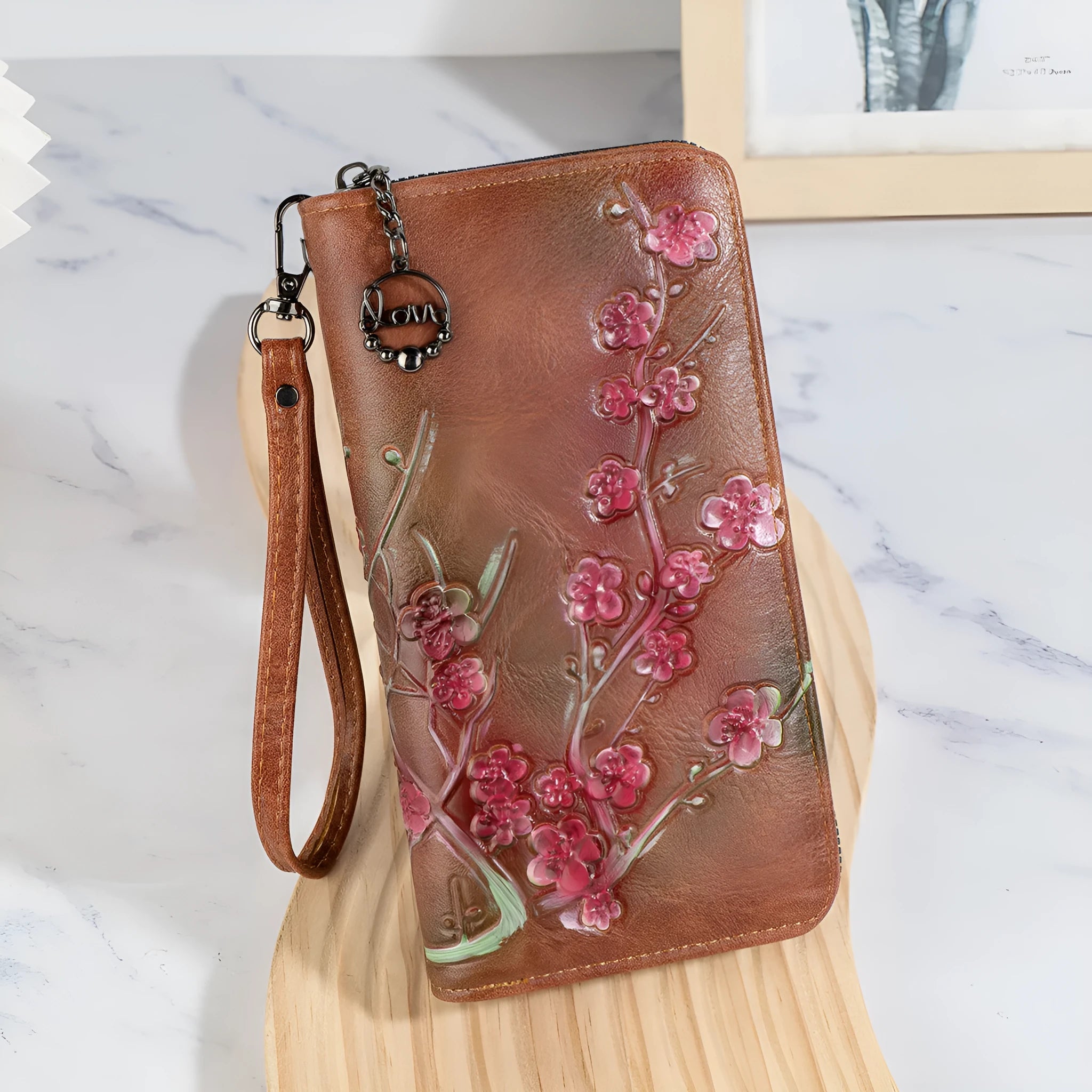 Embossed floral pattern Chinese style handbag in brown colour with zipper closure