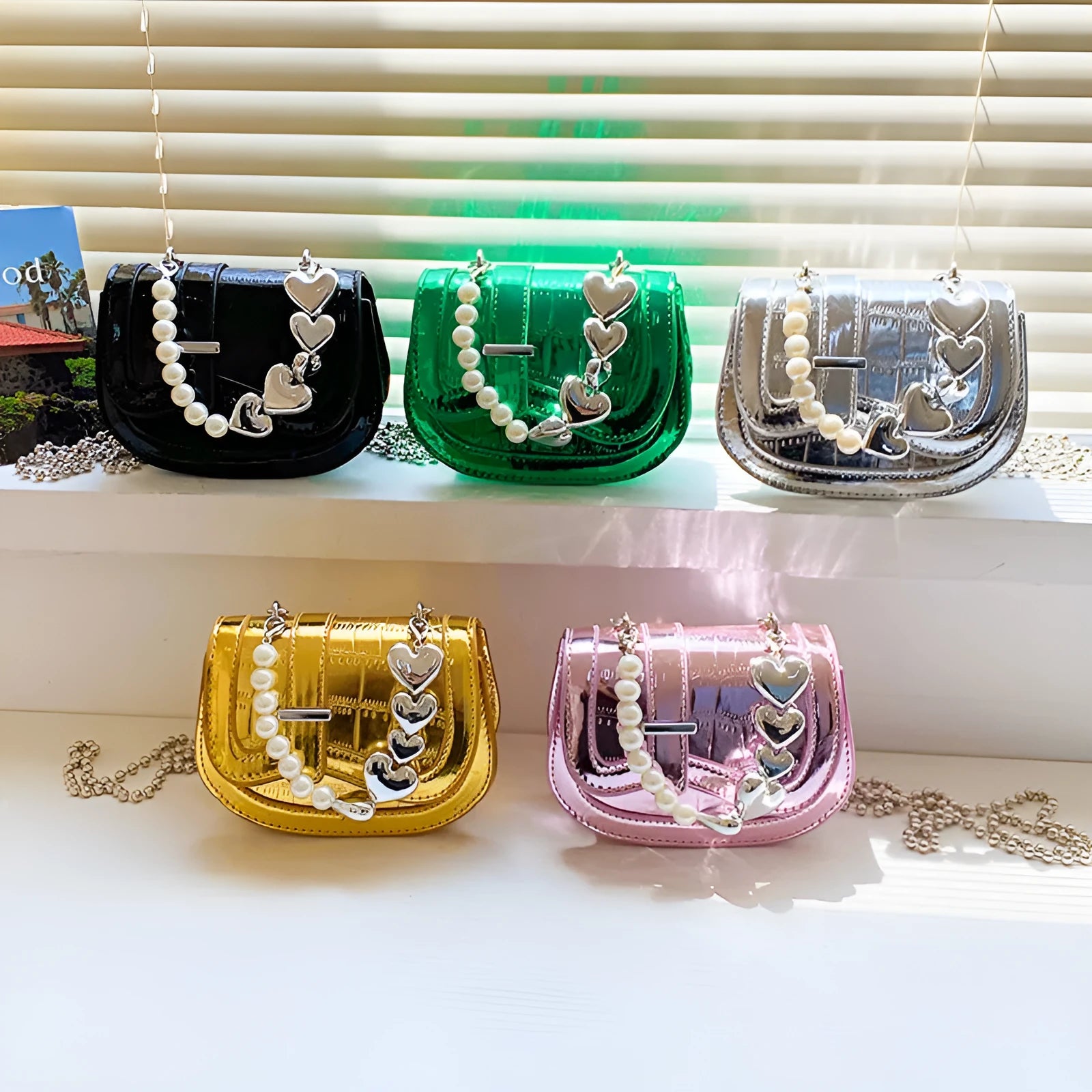 Laser pearl effect mini saddle tote handbag in horizontal square shape with crossbody strap