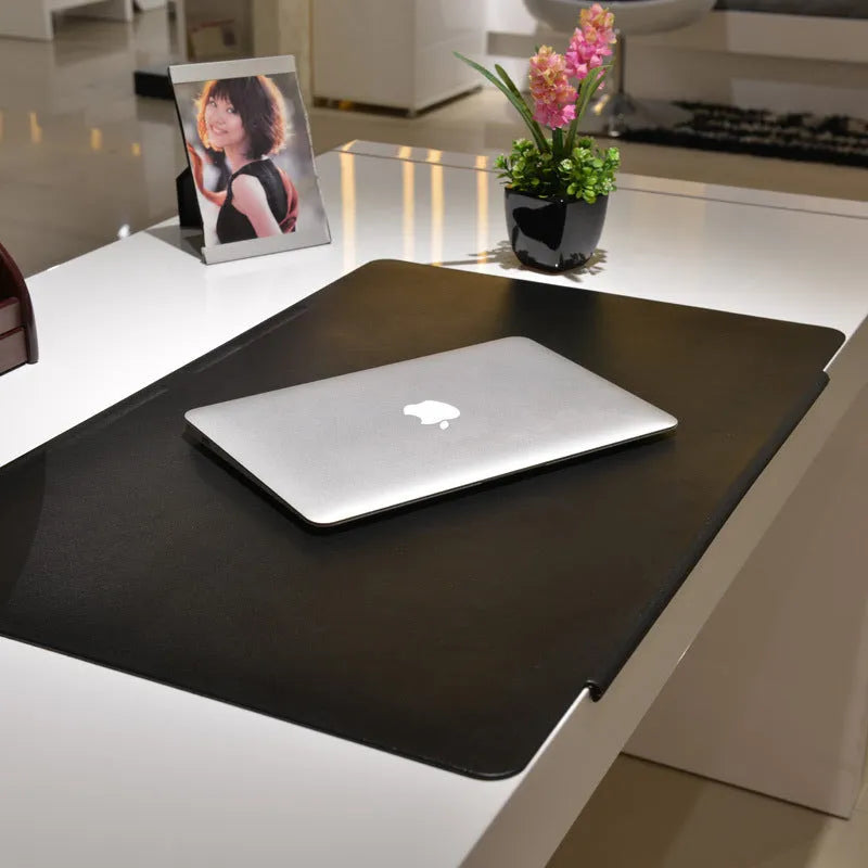 Black large PVC computer desk mat 700x450x3mm for keyboard and mouse on a wooden desk