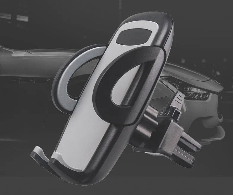 Black plastic universal mobile phone holder attached to a car air vent.