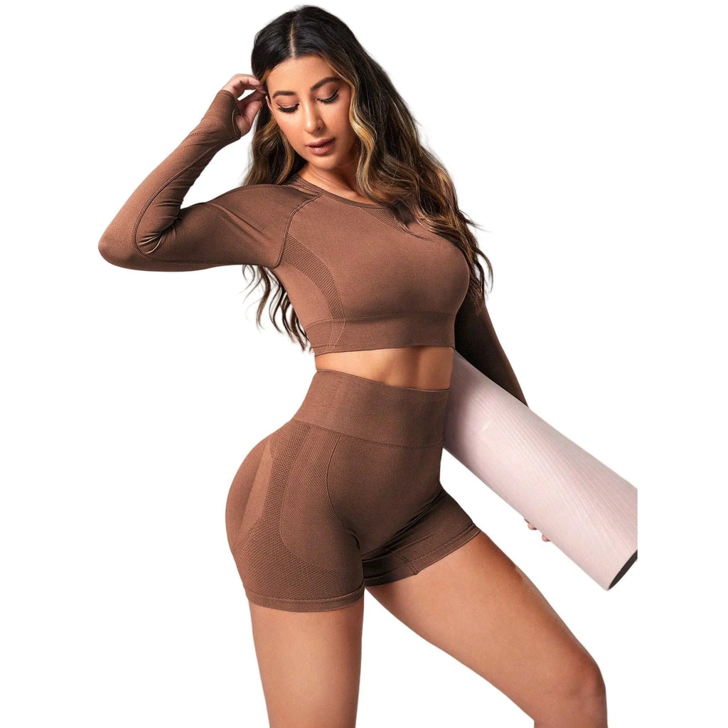 Women's black yoga suit set with high-waisted leggings and long sleeve top for fitness