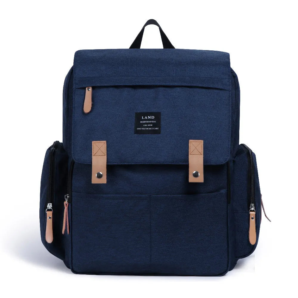 Large Oxford cloth diaper backpack with changing mat in beige colour, dimensions 33x39x15cm