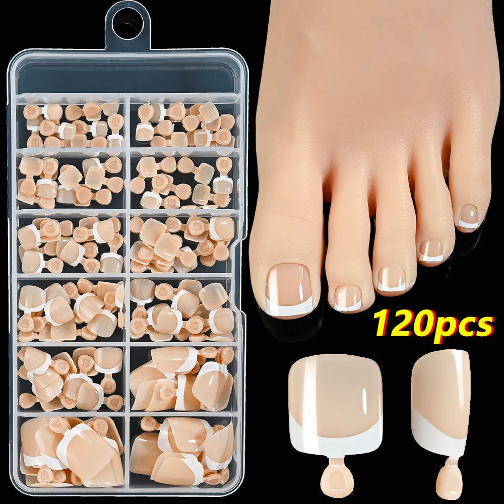 120-piece box of French white tip false toenails in nude colours, square short shape.