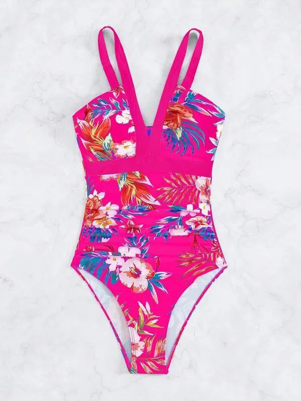 Women's floral patterned, backless one-piece swimsuit on a hanger