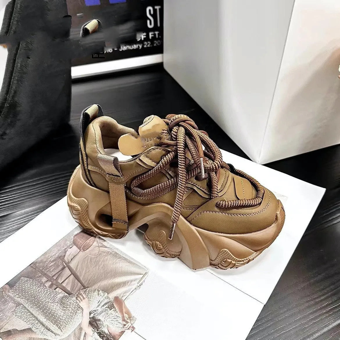 Women's creamy white casual sneakers with cross-strap detail and a built-in wedge heel on a synthetic leather and EVA sole.