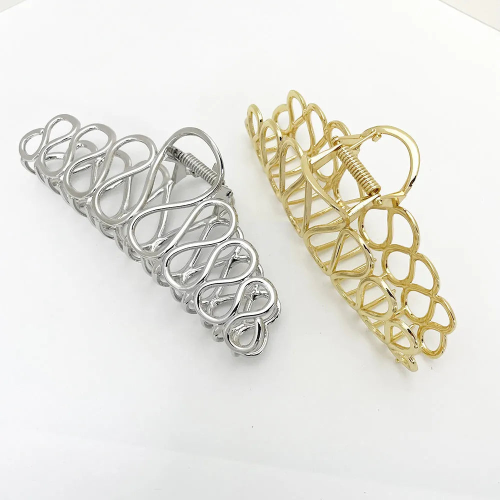 Large gold or silver alloy hair clip with minimalist design and European tassel detailing for women's updo hairstyles