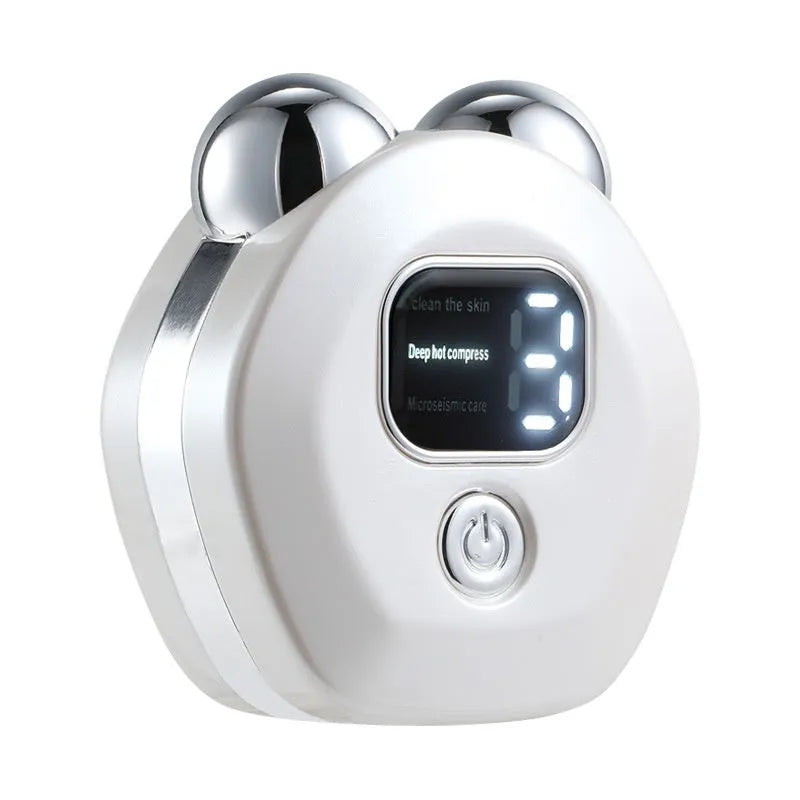 Portable hot compress and micro-current facial massage instrument in white, light blue, and pink colours with charging cable.