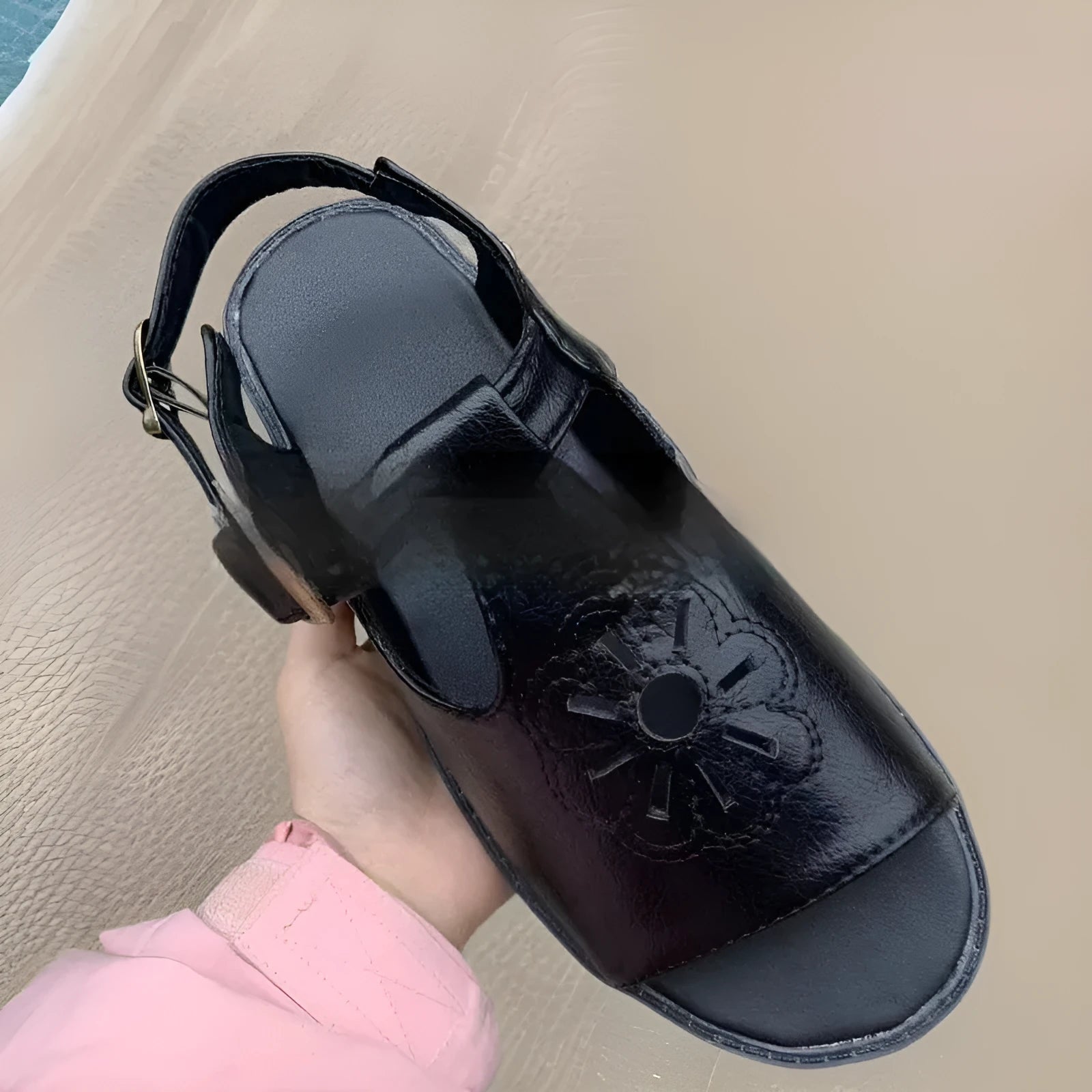 Men's black embroidered floral beach sandals with flat heel, showing PU upper material