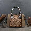Men's brown leather retro messenger bag with front flap and shoulder strap on a wooden table
