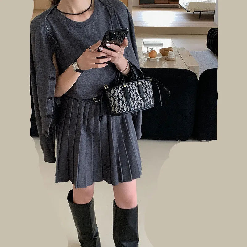 Women's grey national style knitted two-piece set with pleated vest skirt and long-sleeved cardigan.