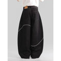 Black straight-leg denim trousers on a hanger, showing mid waist and zip placket detail.