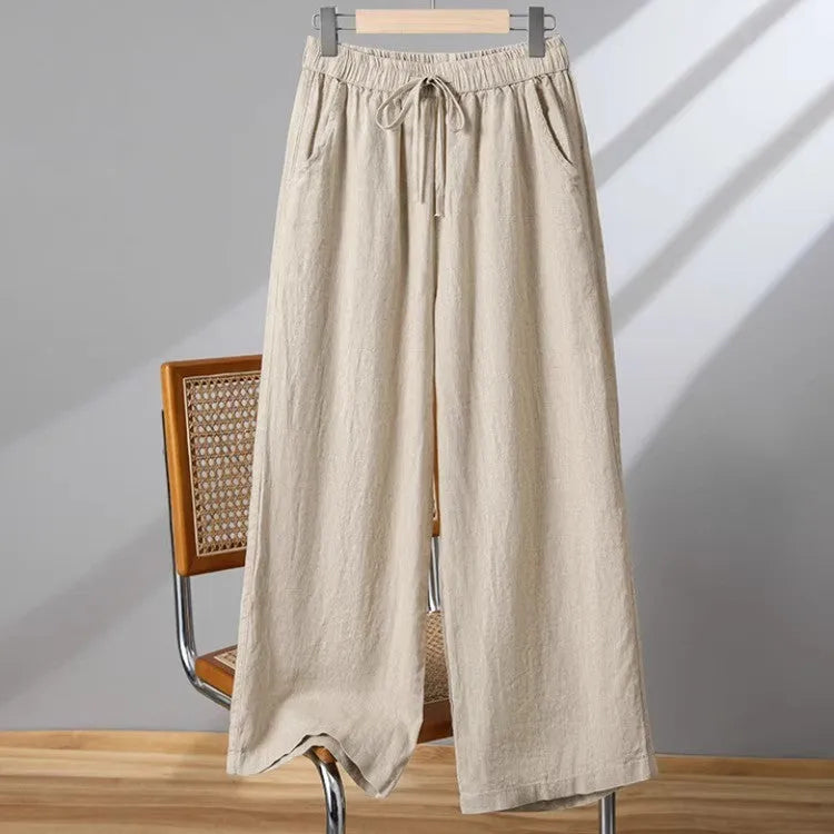 Women's straight-leg casual trousers in apricot colour with elastic waist and lace-up drawstring detail