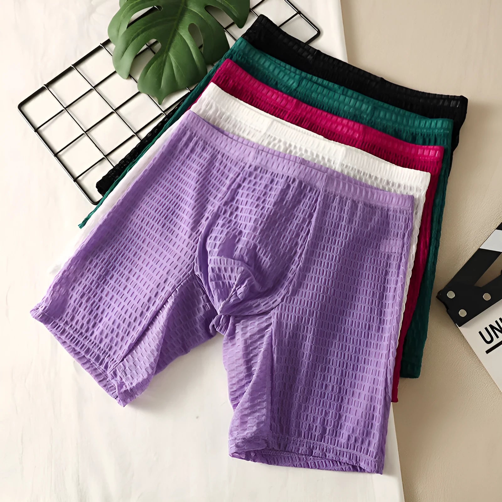 Men's solid colour lace boxer shorts for shaping, shown in multiple colours including rose red and black.