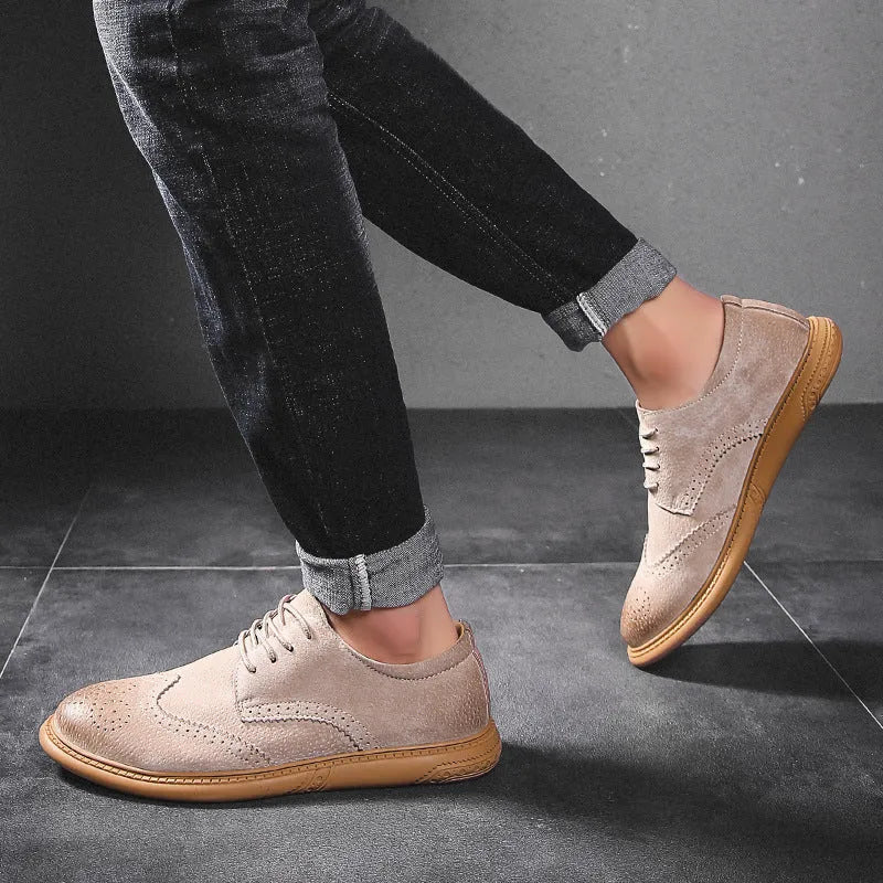 Men's black genuine cowhide leather low top business shoes with lace-up design and rubber sole.