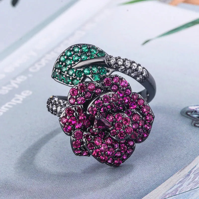 Gold-plated black gold ring with simulation red corundum stone and geometric flower design