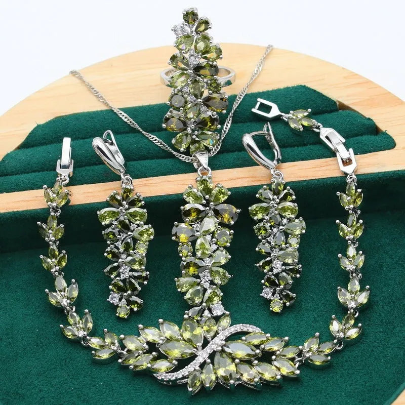 Retro botanical pattern jewellery set in copper alloy with zircon stones, showing necklace, bracelet, earrings, and ring.
