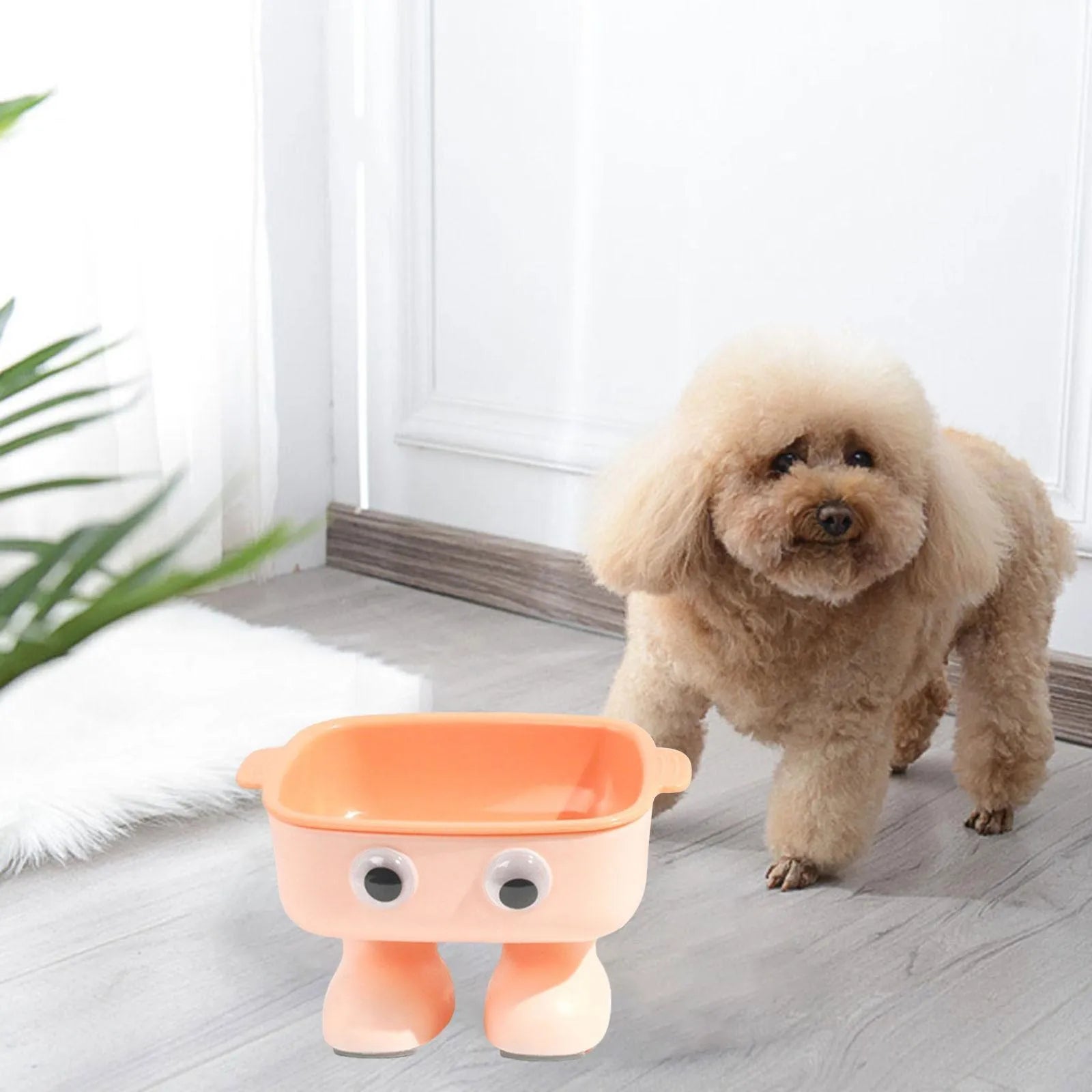 Green robot-shaped elevated cat bowl with tilted dish and non-slip base