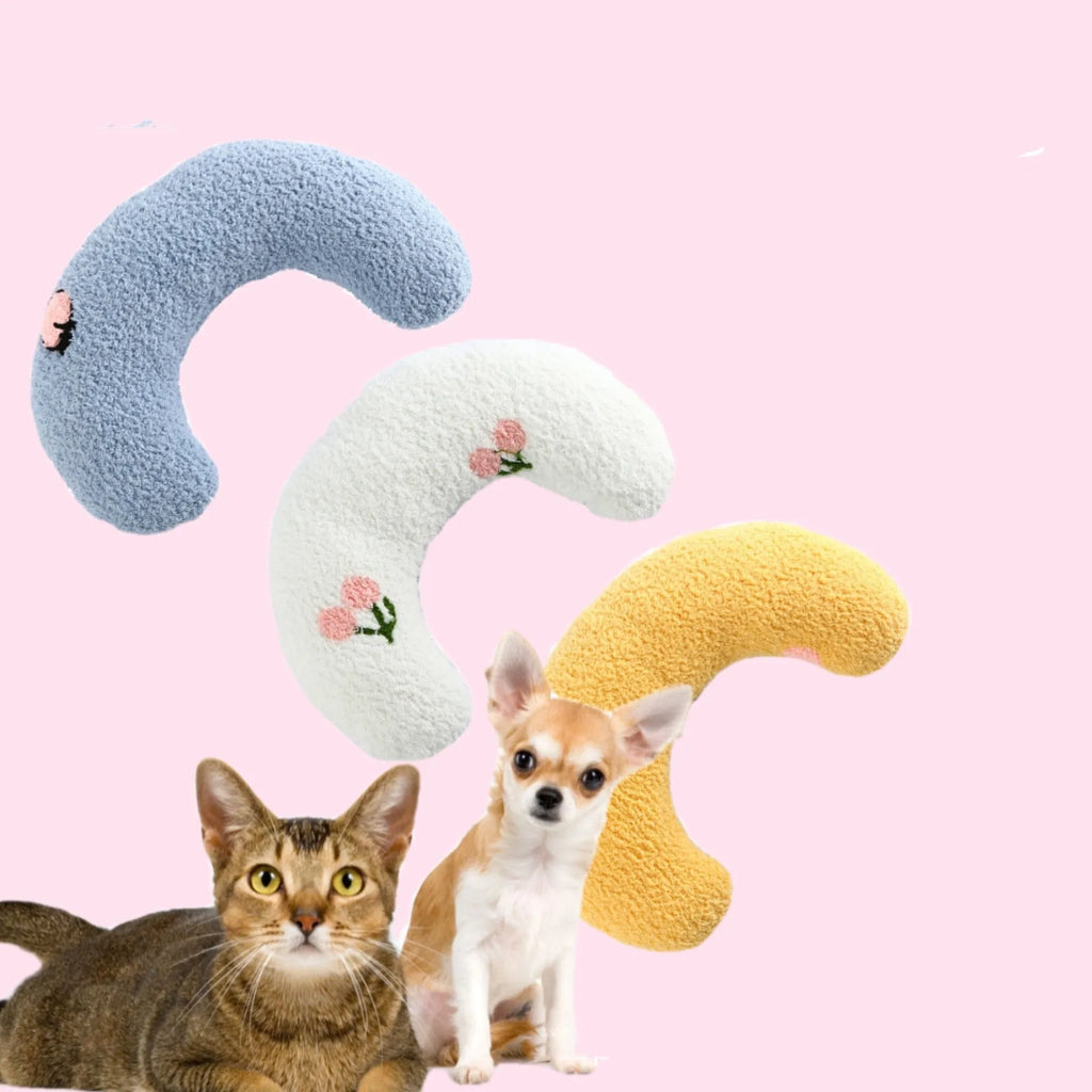 Small blue U-shaped plush pillow for cats or small dogs on a white background.