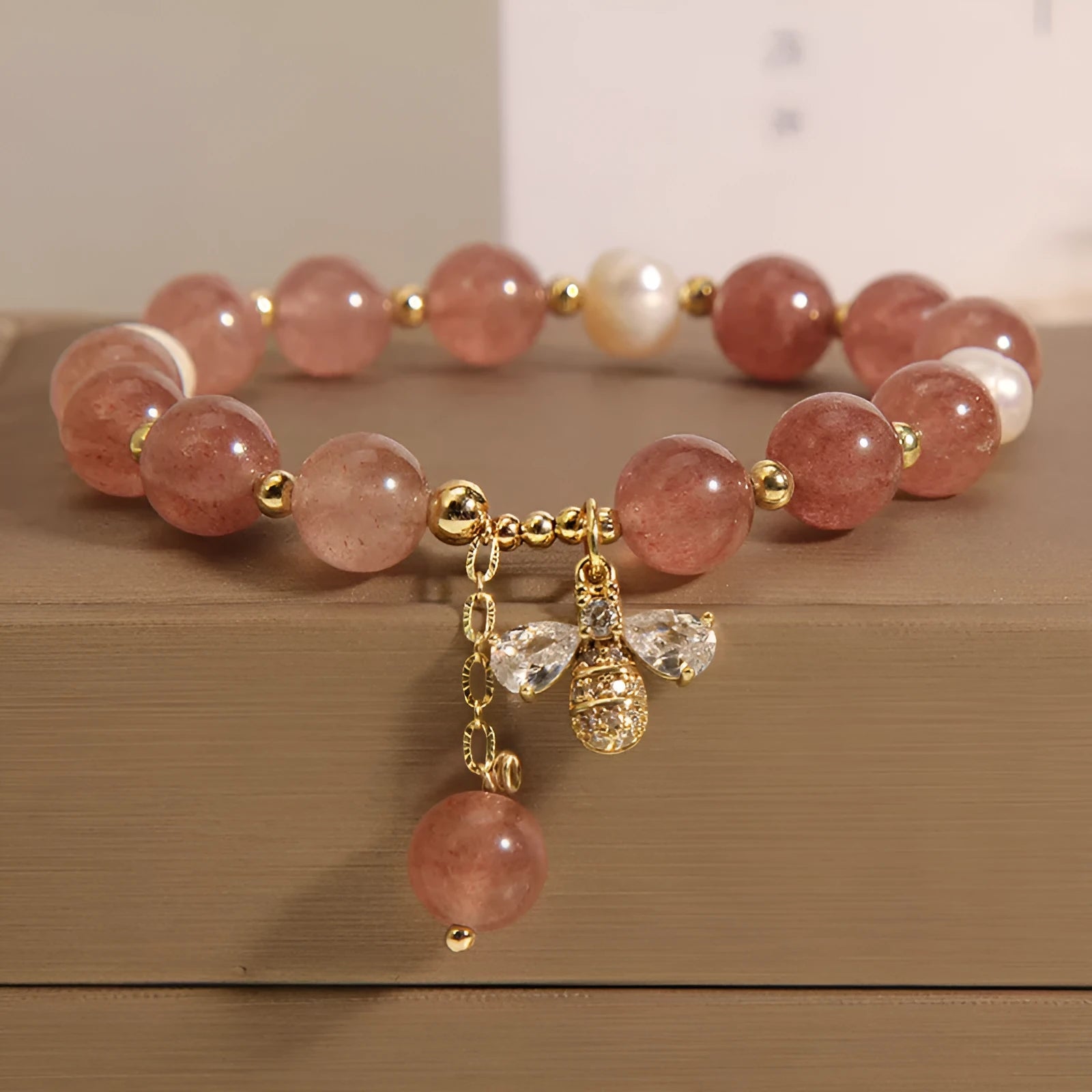 Women's freshwater pearl and strawberry quartz bracelet with zircon details on alloy chain