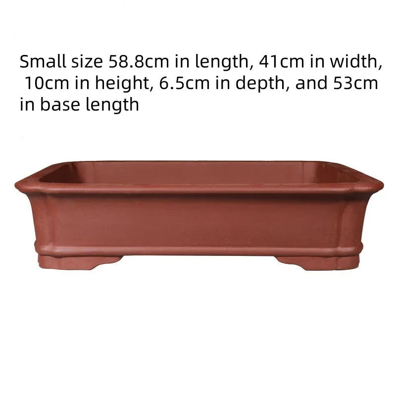 Large rectangular purple clay flowerpot showing handmade texture and substantial rectangular shape
