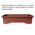Large rectangular purple clay flowerpot showing handmade texture and substantial rectangular shape