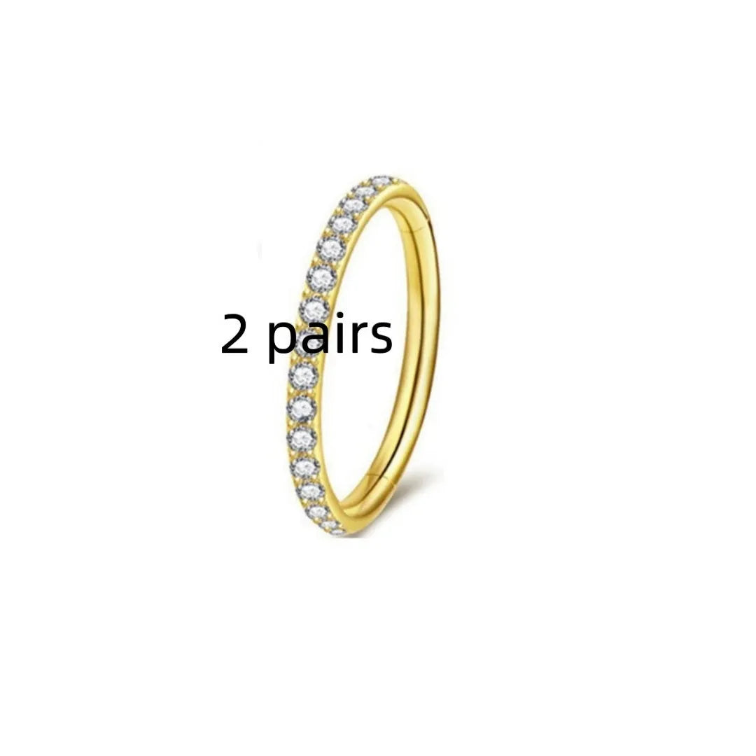 Stainless steel seamless nose rings showing steel, gold, rose gold, and black electroplated finishes with round design